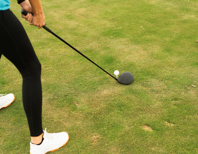 golfer with ball on tee
