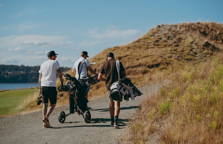 group of golfers walking with clubs