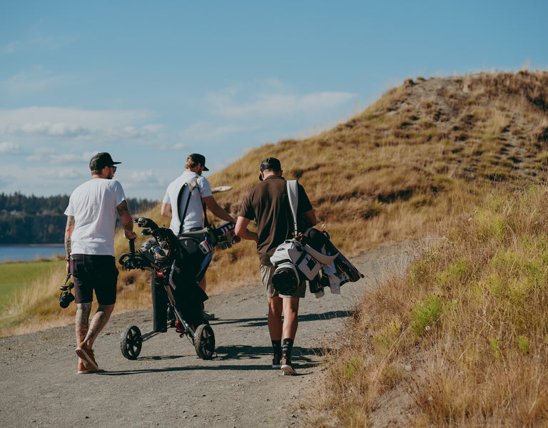 group of golfers walking with clubs