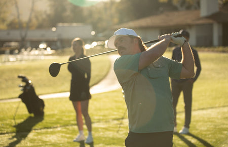 A golfer swinging a driver