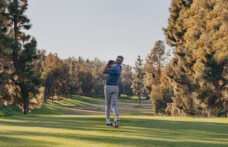 golfer hitting a distance drive of the tee