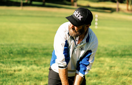golfer lining up a high shot