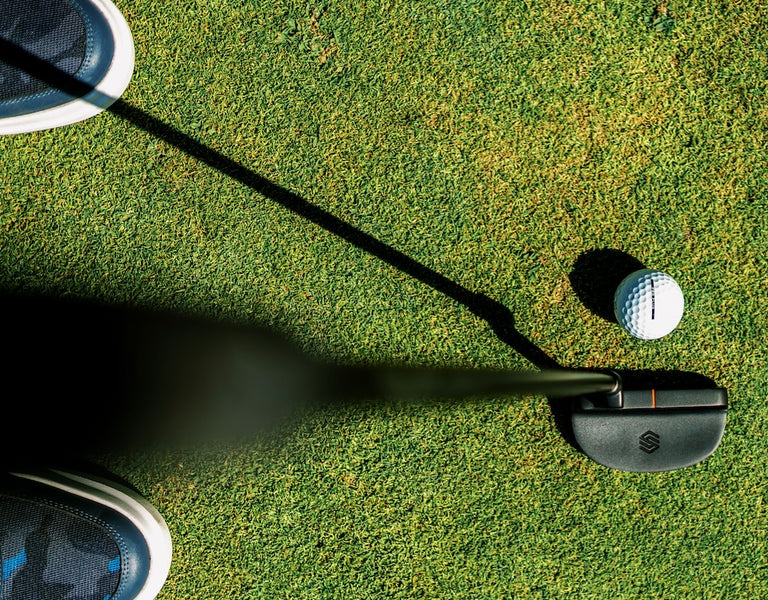 golfer preparing to make putt