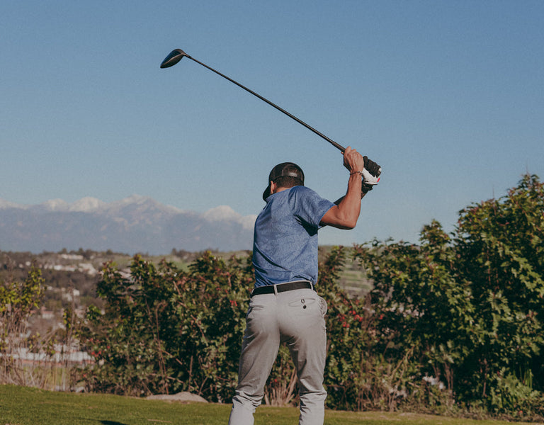 golfer taking his shot