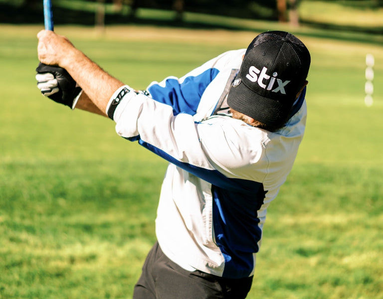 golfer hitting ball from tee and monitoring launch
