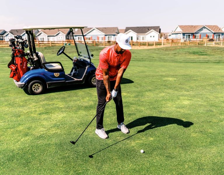 golfer using Stix hybrid club on fairway