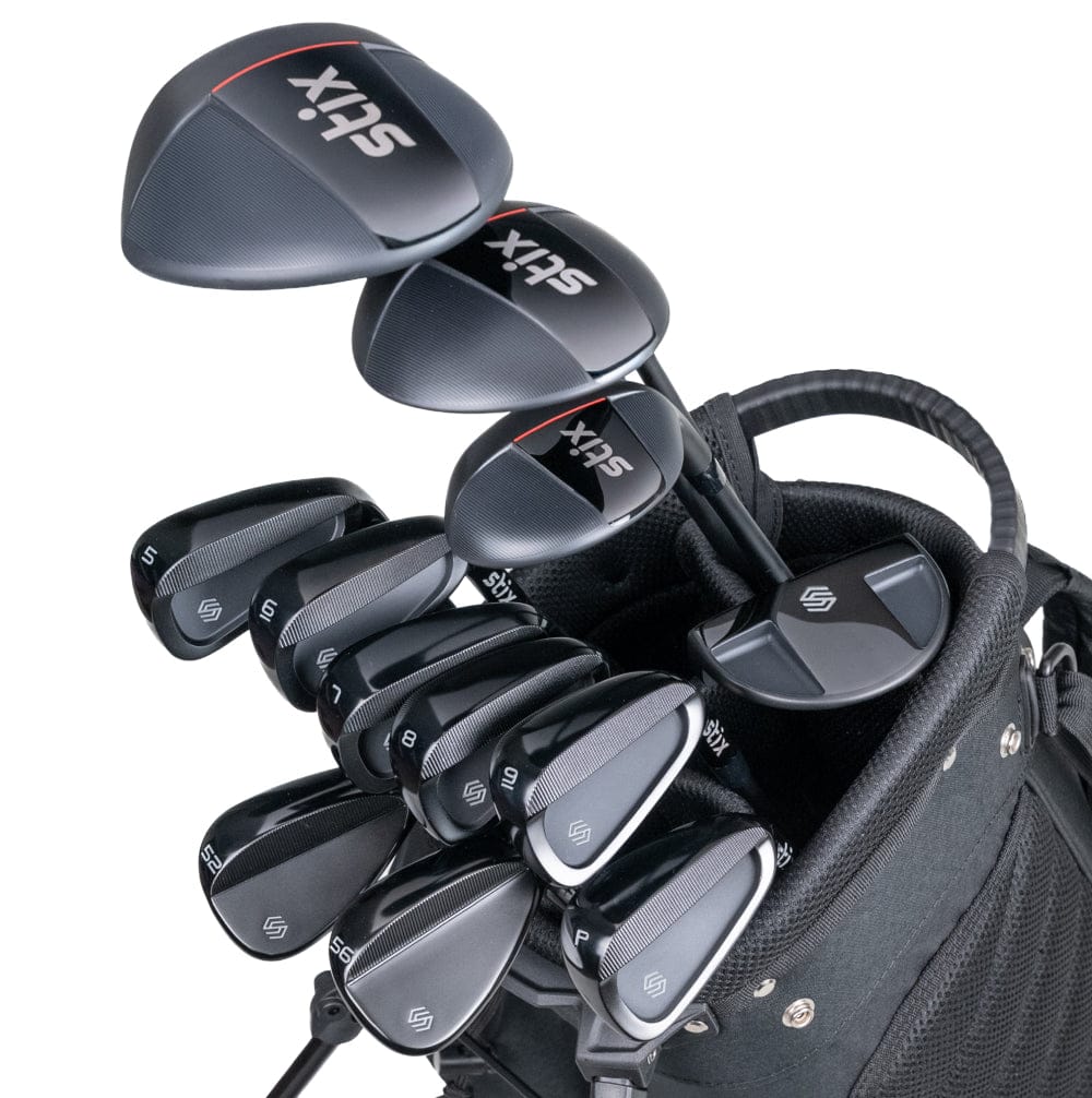 A complete Stix golf club set including driver, irons, wedges, putter, and bag laid out on a fairway.