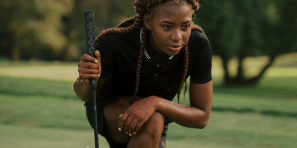 female golfer with Stix putter