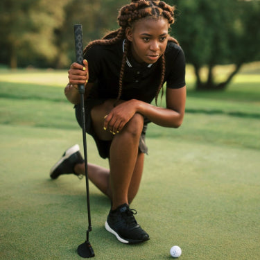 female golfer with Stix putter