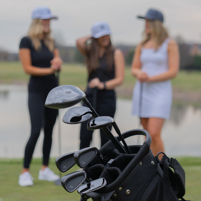 Female Golfers and Golf Club Set