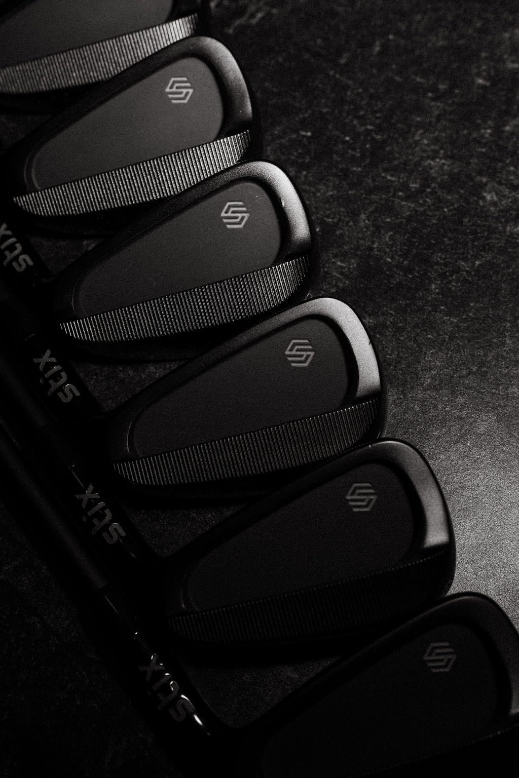 A complete Stix golf club set in matte black.