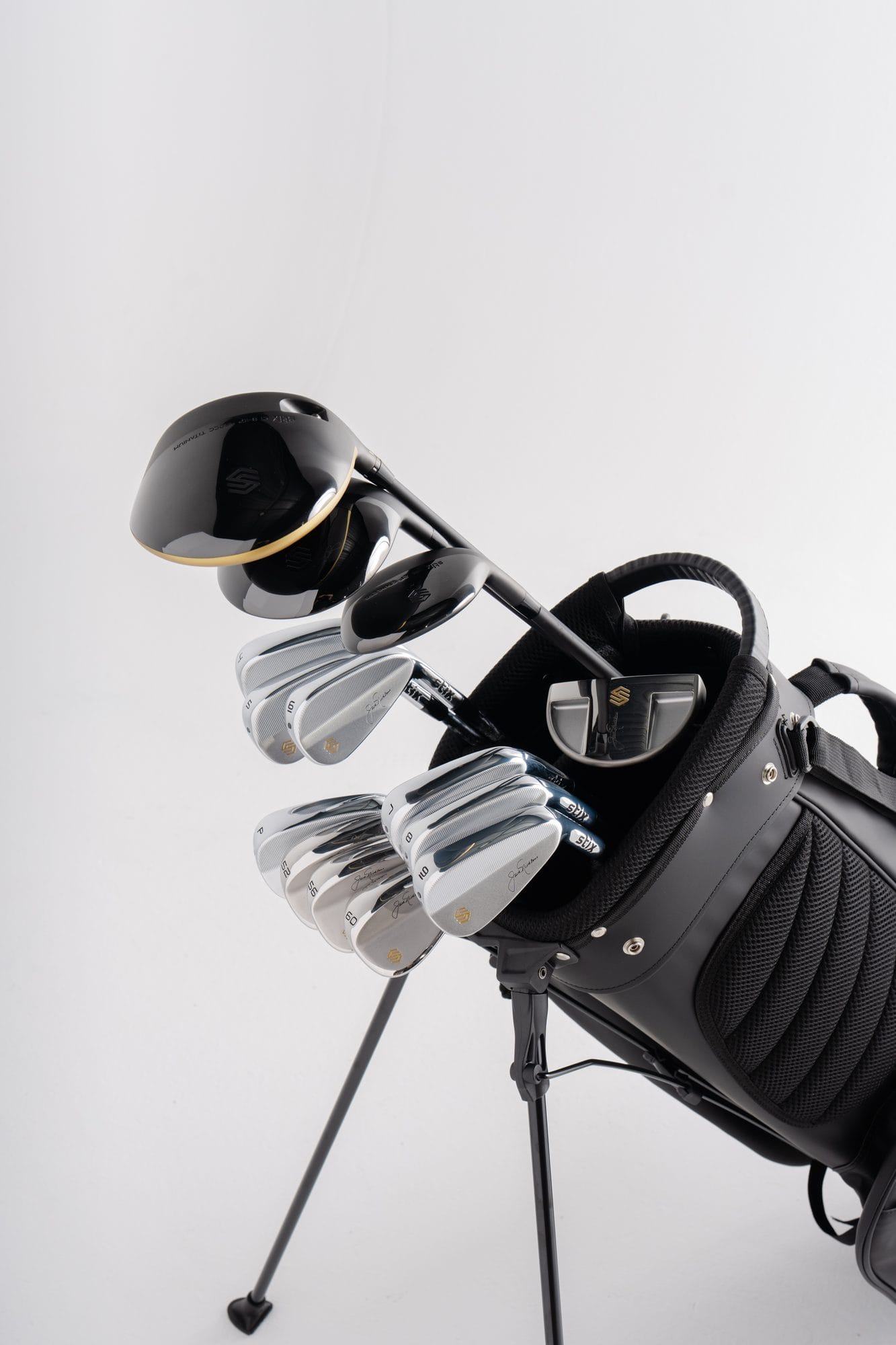 A complete Stix golf set in the Stix stand bag: driver, irons, and putter visible — one box, everything to play.